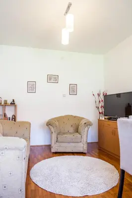 a living room with a couch and a tv at Apartments Heaven in Cetinje