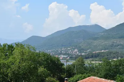 a view of a valley with mountains in the background at Kristina Apartments in Tivat