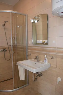 a bathroom with a sink and a shower at Kristina Apartments in Tivat