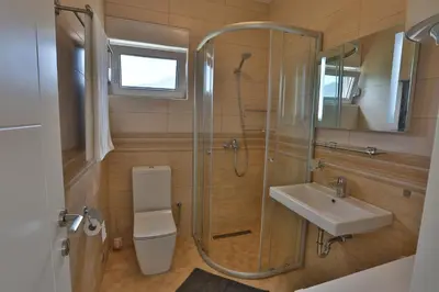 a bathroom with a shower and a sink at Kristina Apartments in Tivat