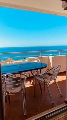 a blue table and chairs on a cruise ship at Adriatic Apartments in Ulcinj