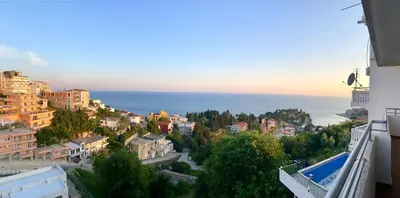 a view of a city with the ocean in the background at Adriatic Apartments in Ulcinj