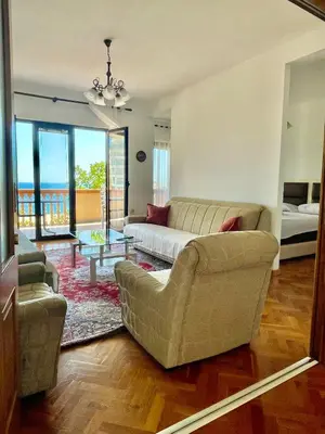 a living room with a couch and a table at Adriatic Apartments in Ulcinj