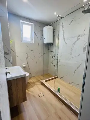 a bathroom with a shower and a sink at Apartment Luxury Explorer in Podgorica