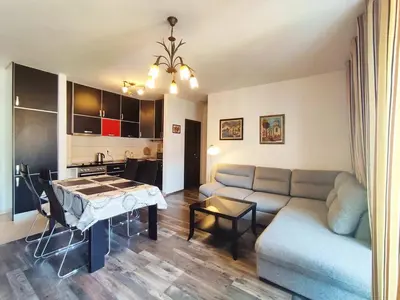 a living room with a couch and a table at Adrialux2 in Budva
