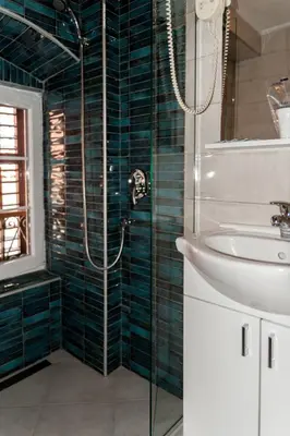 a bathroom with a shower and a sink at Hotel Rendez Vous in Kotor