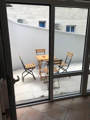 a patio with a table and chairs on a balcony at Impuls 2 in Budva