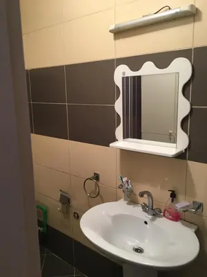 a bathroom with a sink and a mirror at Impuls 2 in Budva