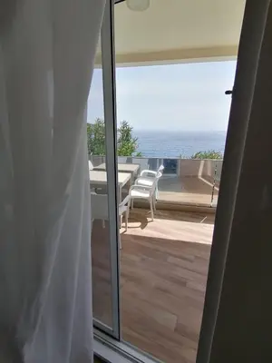 a view of the ocean from the balcony of a house at Your Home Montenegro in Dobra Voda