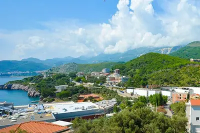 a view of a town with a body of water at Belveder Apartments in Budva