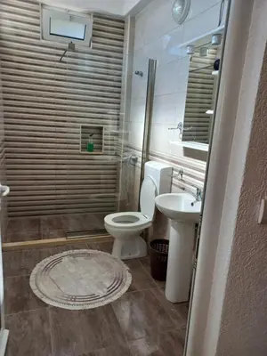a bathroom with a toilet and a sink at Apartments Antigona Old Town in Ulcinj