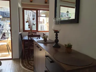 a kitchen with a counter with a vase on it at Apartments Antigona Old Town in Ulcinj