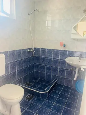 a bathroom with a toilet and a sink at Apartments MM Budva in Budva