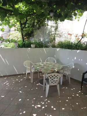 a table and chairs sitting on a patio at Apartments MM Budva in Budva