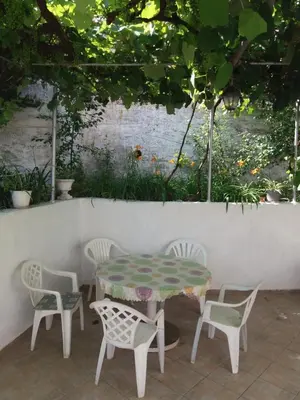 a table and four chairs and a table and a table at Apartments MM Budva in Budva