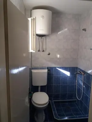 a bathroom with a toilet and a shower at Apartments MM Budva in Budva