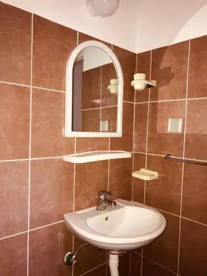 a bathroom with a sink and a mirror at Apartments MM Budva in Budva