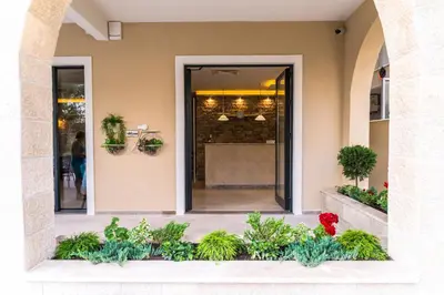 a store front of a building with plants at B&B Amfora in Petrovac na Moru