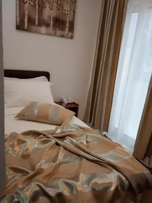 a bed in a room with a window and a bed sidx sidx at 
