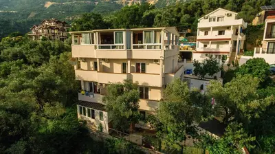 an apartment building on the side of a hill at 