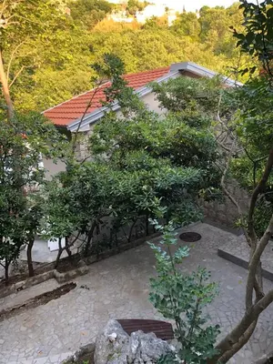 an overhead view of a courtyard with trees and a building at Villa Masha in Rijeka Reževići
