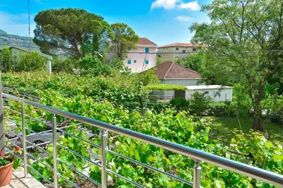 a balcony with a view of a garden at Apartmani Mihovic - JAZ in Budva