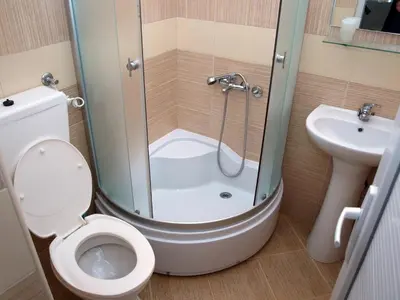 a bathroom with a shower and a toilet and a sink at Arabela Apartments in Utjeha