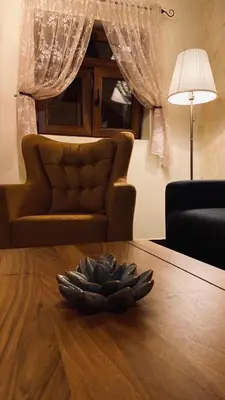 a pile of feathers on a table in a living room at Eco Villas Merak in Virpazar