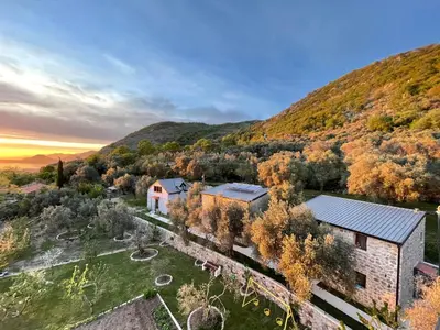 an aerial view of a house in the mountains at Apart & Spa Beganovic in Dobra Voda