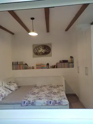 a bedroom with a bed in a room at Apartman Lora in Budva