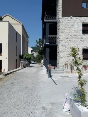 an empty street in front of a building at Apartman Lora in Budva