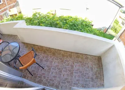 a balcony with a bench and a tennis racket at Rajovic Apartments in Tivat