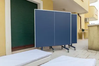 a large blue locker sitting outside of a building at Allegro Apartment Sekulic in Petrovac na Moru