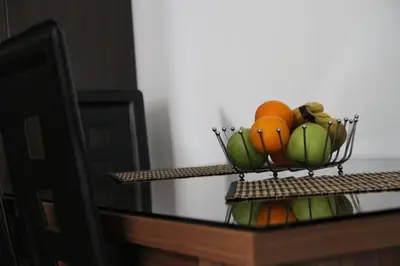 a bowl of fruit on top of a table at Ruza apartman in Budva