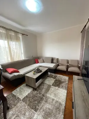 a living room with a couch and a coffee table at Apartments Radulović in Ulcinj