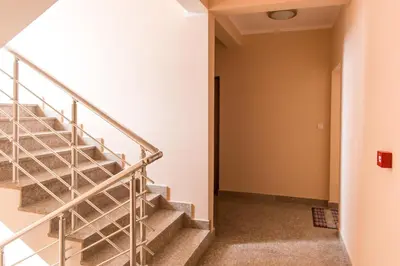 a staircase in an apartment building with a stair railing at Bečiči - Andrea apartman in Becici