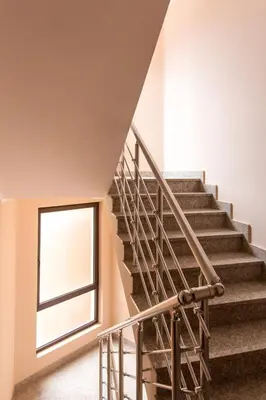 a staircase in a house with a window at Bečiči - Andrea apartman in Becici