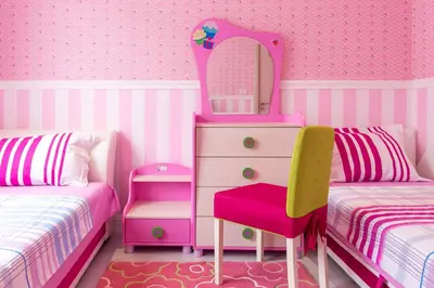a pink bedroom with a dresser and a mirror at Bečiči - Andrea apartman in Becici