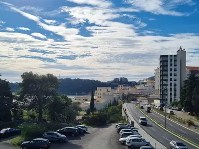 a bunch of cars parked in a parking lot at Bečiči -Big apartments in Becici