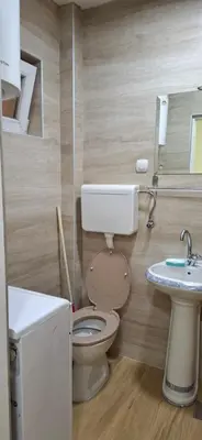 a bathroom with a toilet and a sink at Sunčani apartman 2-Vila Amfora in Budva