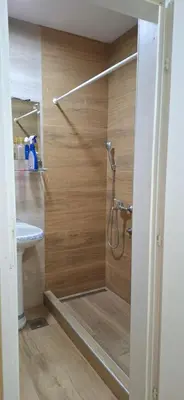 a bathroom with a shower and a sink at Sunčani apartman 2-Vila Amfora in Budva