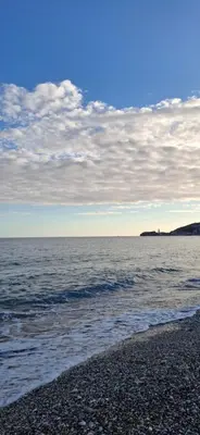 a beach with a cloudy sky and the ocean at Sunčani apartman 2-Vila Amfora in Budva