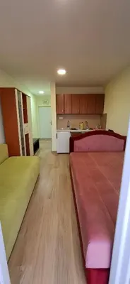 a large room with two beds and a kitchen at Sunčani apartman 2-Vila Amfora in Budva