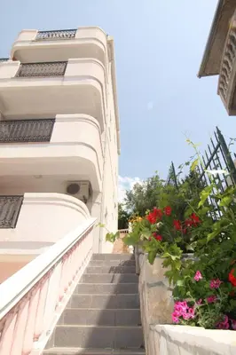 a stairway leading up to a building with flowers at Villa Beba in Dobra Voda