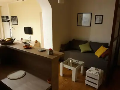 a living room with a couch and a table at Apartman Centar in Cetinje