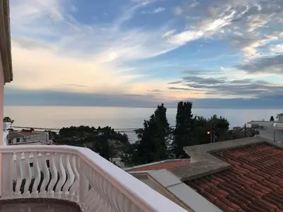 a view of the ocean from the balcony of a house at Apartments Harmony in Ulcinj