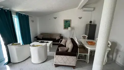 a living room with a couch and a table at Apartments Harmony in Ulcinj