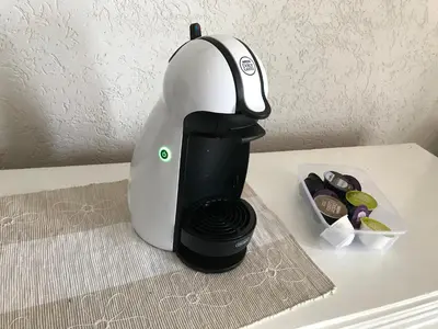a coffee maker sitting on top of a table at Apartments Harmony in Ulcinj