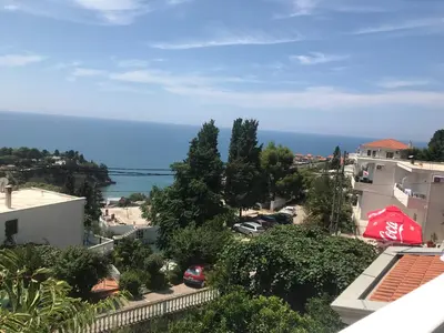a view of the ocean from the balcony of a building at Apartments Harmony in Ulcinj
