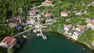 an aerial view of a river with houses and a dock at Studio Apartment Cudo Nevidjeno in Karuč